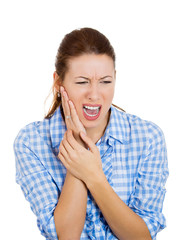 Woman with tooth ache, headache touching face