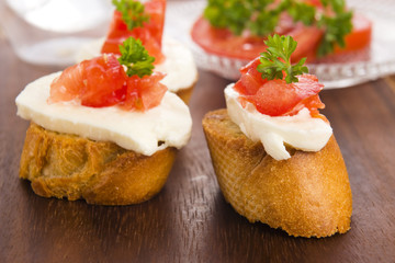 Bruschetta with mozarella and tomatoes