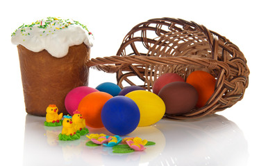 Eggs near basket and Easter cake with sweet jewelry