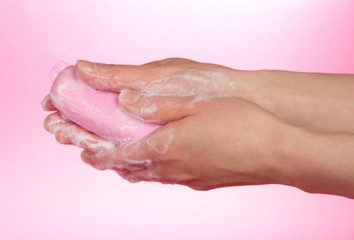Fototapeta premium Piece of fragrant soap in female hands