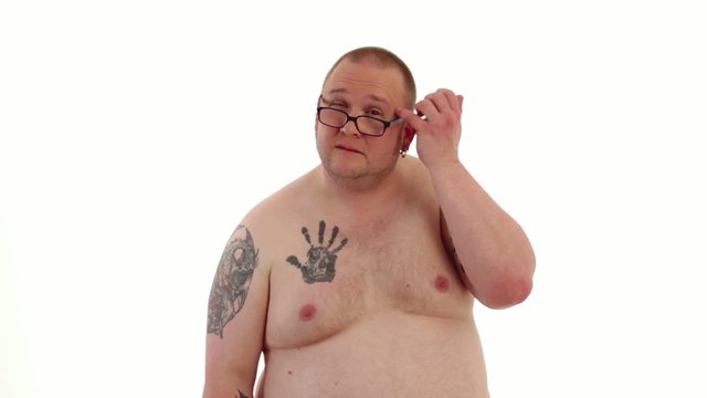 tattooed man styles himself 