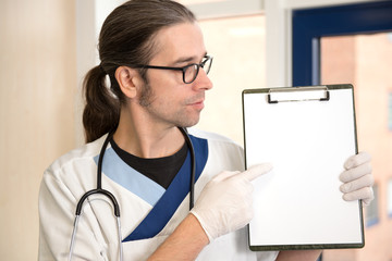 male nurse is pointing to a form