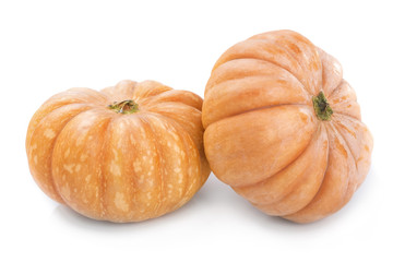 Two big yellow ripe pumpkin close-up on white background.