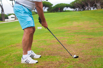 Fototapeta premium Close-up of a man playing golf
