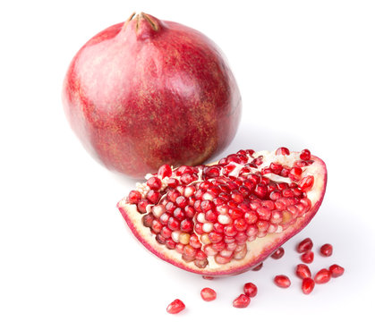 Fresh, ripe, organic pomegranate fruit on white background.