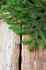 Fir branches on a wooden table