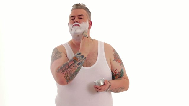 tattooed man shaves off