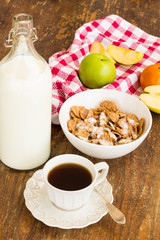 Healthy breakfast with granola, fruits, nuts and milk.