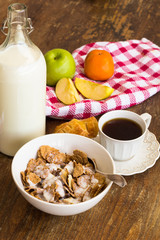 Healthy breakfast with granola, fruits, nuts and milk.