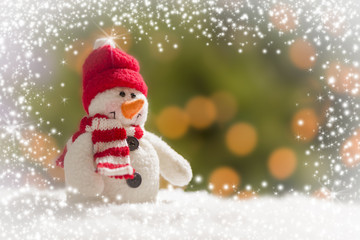 Cute Snowman Over Abstract Snow and Light Background