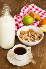 Healthy breakfast with granola, fruits, nuts and milk.