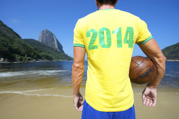 Brazil 2014 Soccer Football Player Stands on Rio Beach