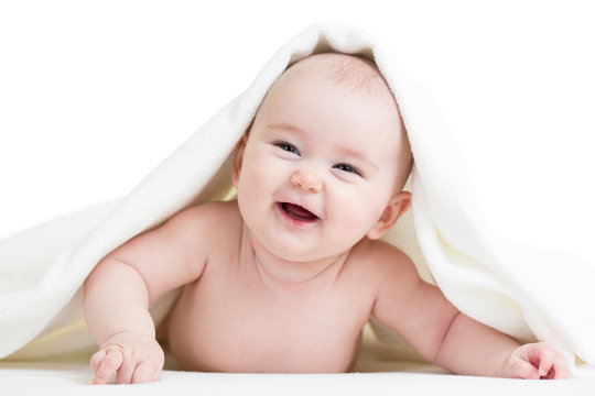 happy baby girl in towel