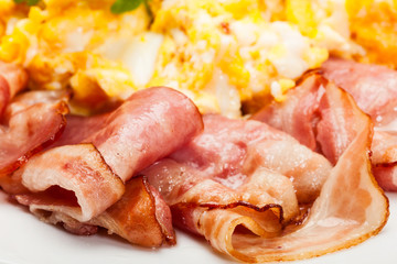 Closeup of scrambled eggs with bacon