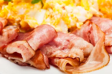 Papier Peint photo Oeufs sur le plat Closeup of scrambled eggs with bacon