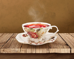 Porcelain tea cup over wooden table with clipping path