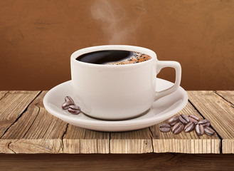 Cup of coffee over wooden table with clipping path