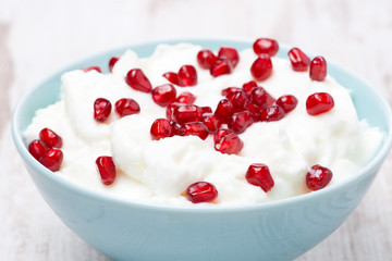 homemade yogurt with pomegranate seeds, close-up