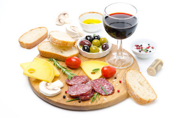 Fototapeta na wymiar salami, cheese, bread, olives, tomatoes and glass of red wine
