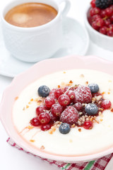 semolina porridge with fresh berries, nuts and coffee