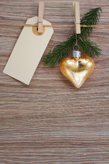 golden heart and evergreen twig with tag
