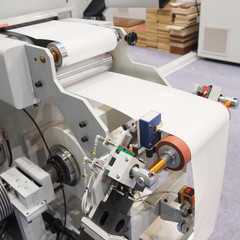 machine for sticking on adhesive tape