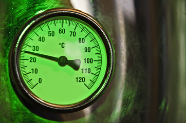 temperature gauge with a shiny metallic frame