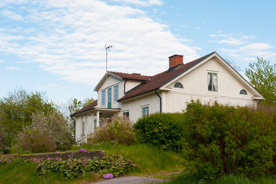 White wooden cottage, Sweden