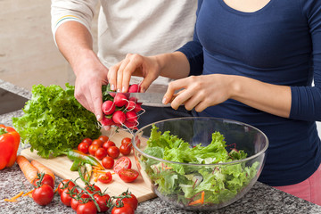 Cutting off a piece of radish for salad