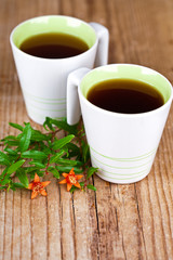 two cups of tea and flower