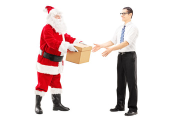 Santa Claus giving a box to a young male