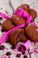 fresh chocolate cookies, coffee beans, pink ribbons and confetti