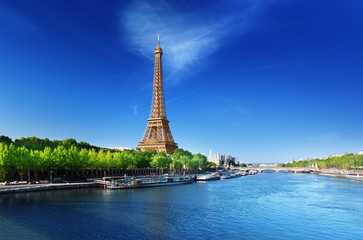 Naklejka na ściany i meble Seine in Paris with Eiffel tower in sunrise time