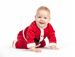 Happy little baby boy in Santa costume