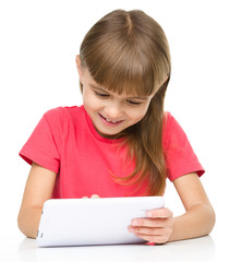 Young girl is using tablet