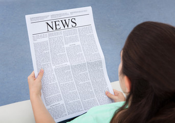 Woman Reading Newspaper