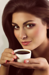 Beautiful woman with coffee cup. Fashion portrait