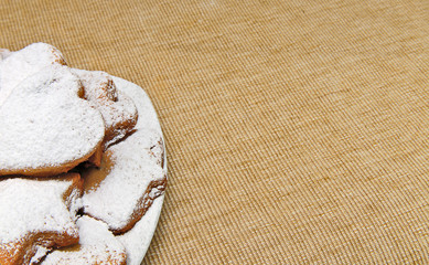 cookies sprinkled powder  on brown sack texture