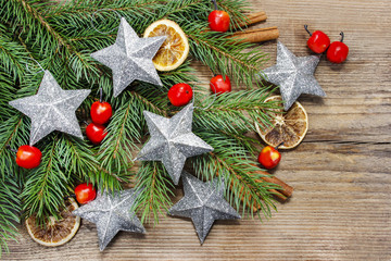 Beautiful christmas background: silver stars, apples and dried f