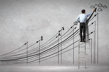 Businessman drawing graphics