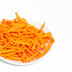 Freshly shredded carrots in small dish