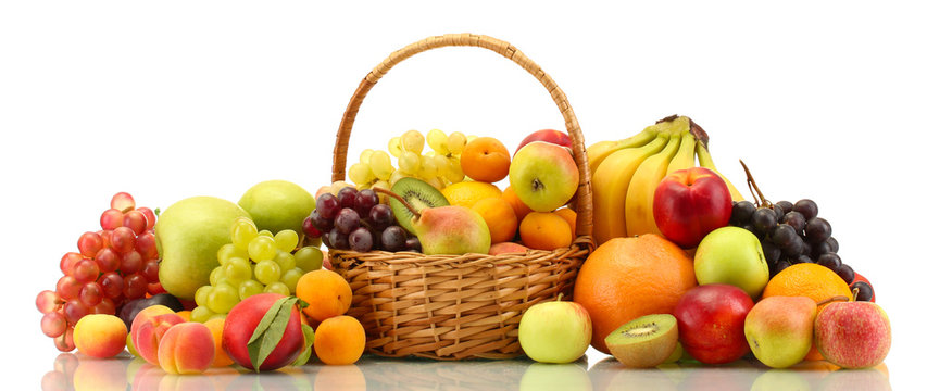 Assortment of exotic fruits in basket isolated on white