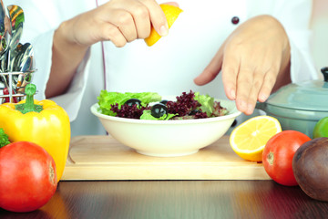 Cook hands prepare salad
