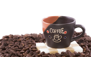 Coffee cup and coffee beans isolated on white