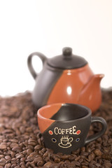 Coffee cup with coffee pot