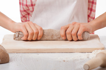 Obraz na płótnie Canvas hands knead rye dough
