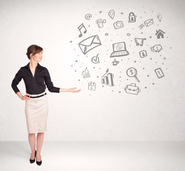 Young business woman presenting hand drawn media icons