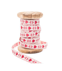 Coil with decorative ribbon on white background