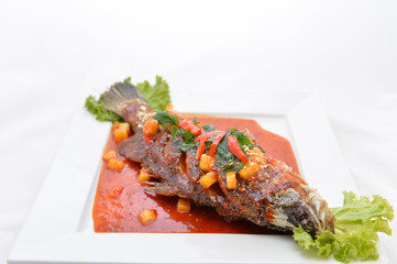 Fried snapper with chili sauce on the plate