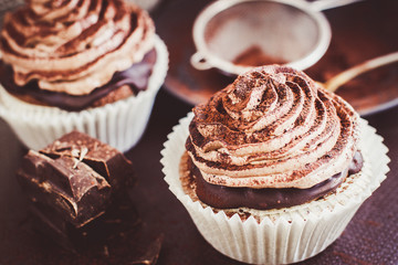 Delicious chocolate cupcakes with butter cream